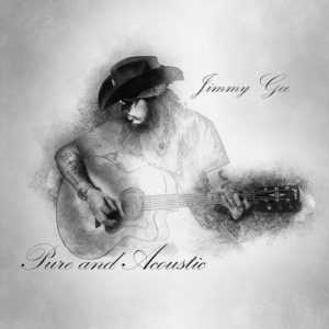 Jimmy Gee mit Gitarre und Cowboyhut in schwarz weiss